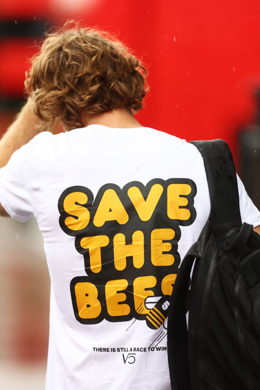 SPIELBERG, AUSTRIA - JULY 07: Sebastian Vettel of Germany and Aston Martin F1 Team walks in the Paddock wearing a Save The Bees shirt during previews ahead of the F1 Grand Prix of Austria at Red Bull Ring on July 07, 2022 in Spielberg, Austria. (Photo by Lars Baron - Formula 1/Formula 1 via Getty Images)