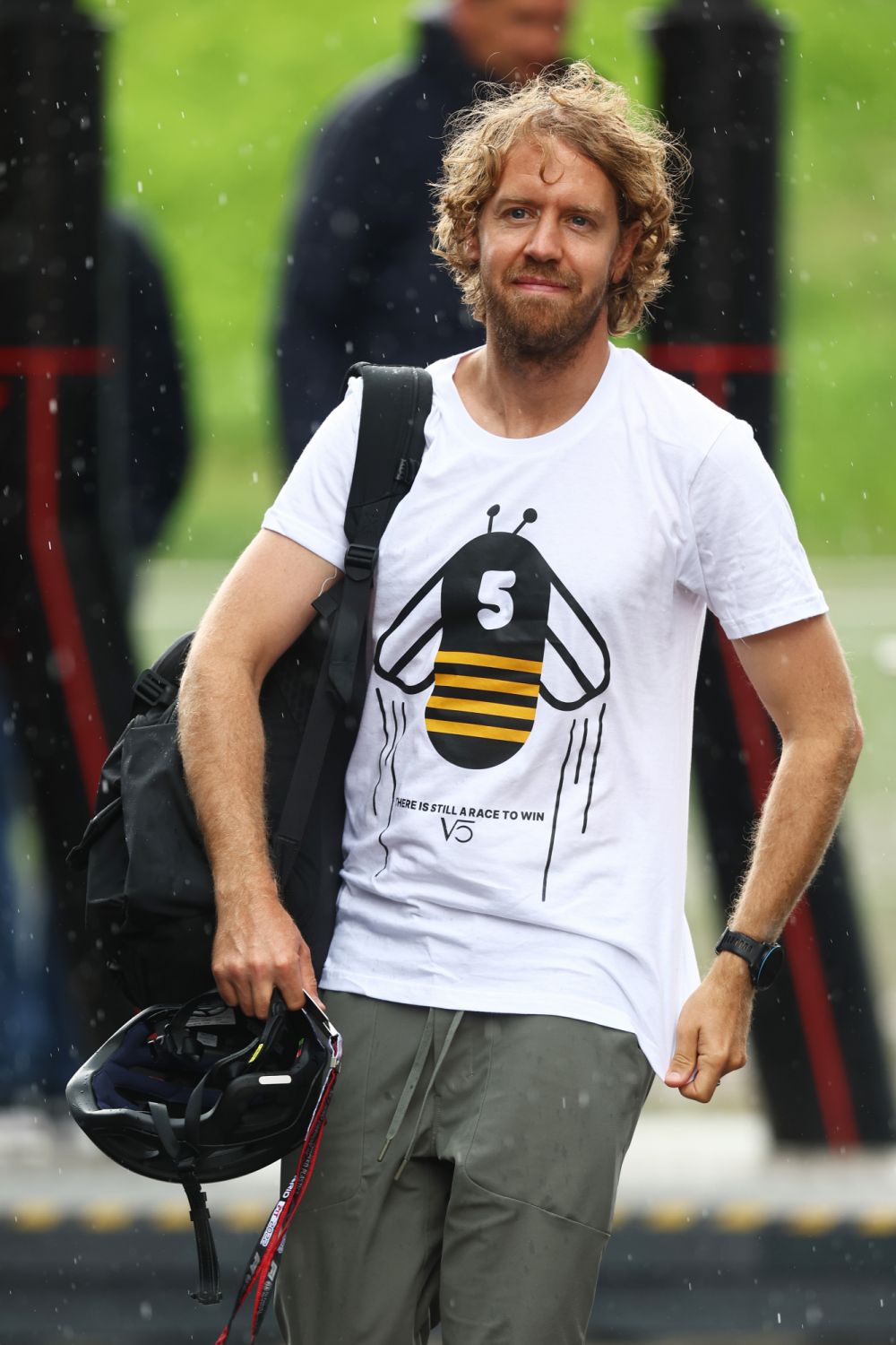 SPIELBERG, AUSTRIA - JULY 07: Sebastian Vettel of Germany and Aston Martin F1 Team walks in the Paddock wearing a Save The Bees shirt during previews ahead of the F1 Grand Prix of Austria at Red Bull Ring on July 07, 2022 in Spielberg, Austria. (Photo by Lars Baron - Formula 1/Formula 1 via Getty Images)