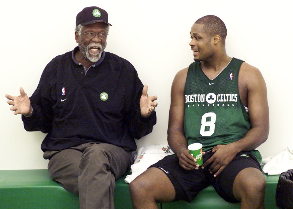 WALTHAM, MA - OCTOBER 10: Celtics legend Bill Russell, left, is pictured with Celtics' Antoine Walker during practice in Waltham, MA on Oct. 10, 2000. (Photo by Barry Chin/The Boston Globe via Getty Images)