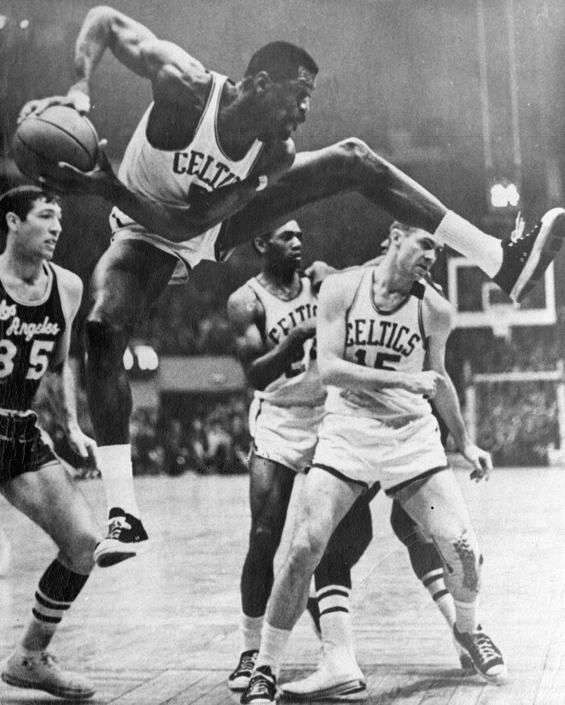 BOSTON - APRIL 26: Boston Celtics player Bill Russell grabs a rebound during a game against the Los Angeles Lakers at the Boston Garden on April 26, 1965. (Photo by Dan Goshtigian/The Boston Globe via Getty Images)