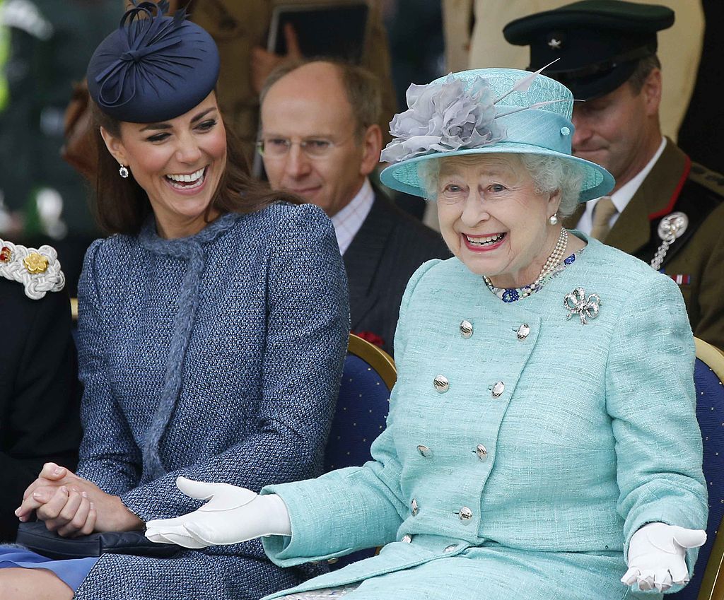 NOTTINGHAM, ENGLAND - JUNE 13: Catherine, Duchess of Cambridge and Queen Elizabeth II watch part of a children's sports event while visiting Vernon Park during a Diamond Jubilee visit to Nottingham on June 13, 2012 in Nottingham, England. (Photo by Phil Noble - WPA Pool/Getty Images)