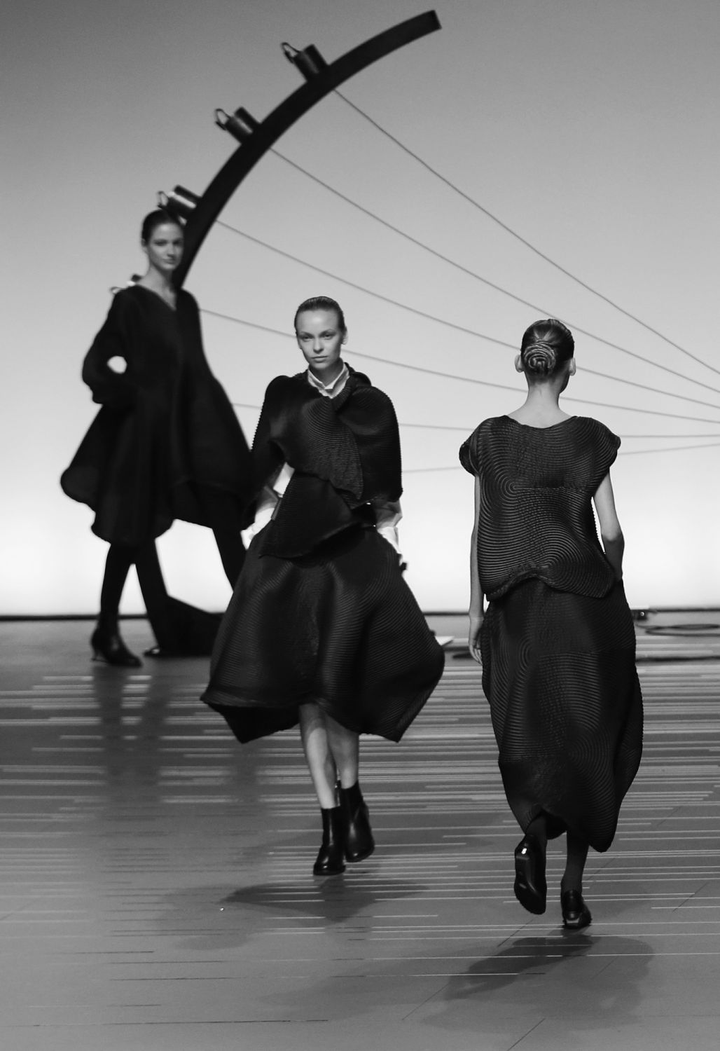 PARIS, FRANCE - FEBRUARY 28:  (EDITORS NOTE: Image converted to black and white) Models walk the runway during the Issey Miyake show as part of the Paris Fashion Week Womenswear Fall/Winter 2014-2015 at Espace Vendome on February 28, 2014 in Paris, France.  (Photo by Vittorio Zunino Celotto/Getty Images)