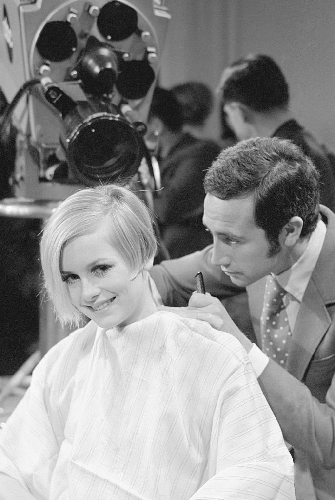 (Original Caption) One of the world's top models, Twiggy, animates as she gets her hair trimmed by one of her countrymen, Leonard of London. Britain's "mod-maid" was having her famous hairdo redone during a press conference on the ABC-TV stage in New York, which was held to announce the network's plans to do three specials on the model's visit to the United States.