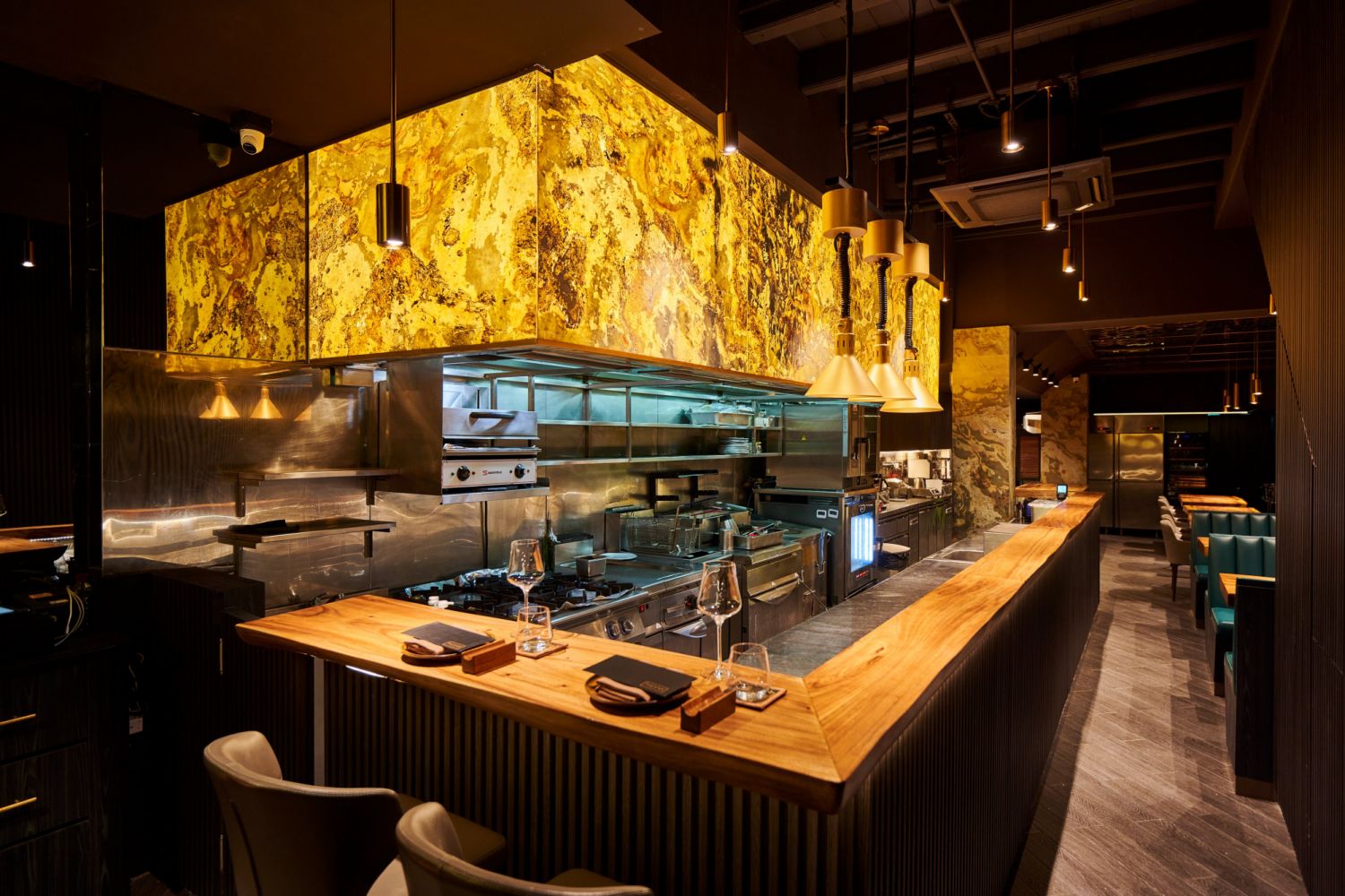 The open kitchen concept allows diners to get a peek into the preparation and plating process.