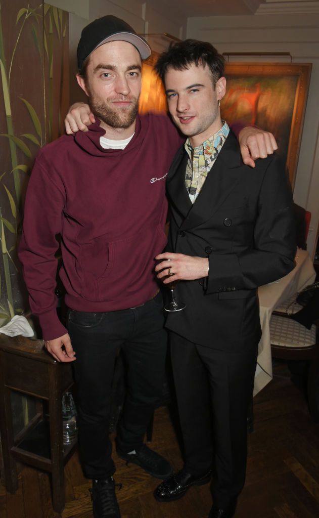 LONDON, ENGLAND - FEBRUARY 19: Robert Pattinson (L) and Tom Sturridge attend the LOVE x Miu Miu Women's Tales dinner hosted by Katie Grand and Elle Fanning at Loulou's on February 19, 2018 in London, England. (Photo by David M. Benett/Dave Benett/Getty Images for Miu Miu)