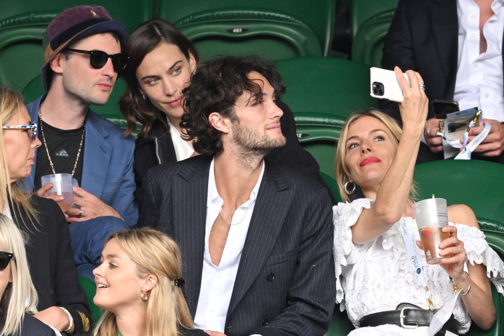 LONDON, ENGLAND - JULY 03: Tom Sturridge, Alexa Chung, Oli Green and Sienna Miller attend the All England Lawn Tennis and Croquet Club on July 03, 2022 in London, England. (Photo by Karwai Tang/WireImage)