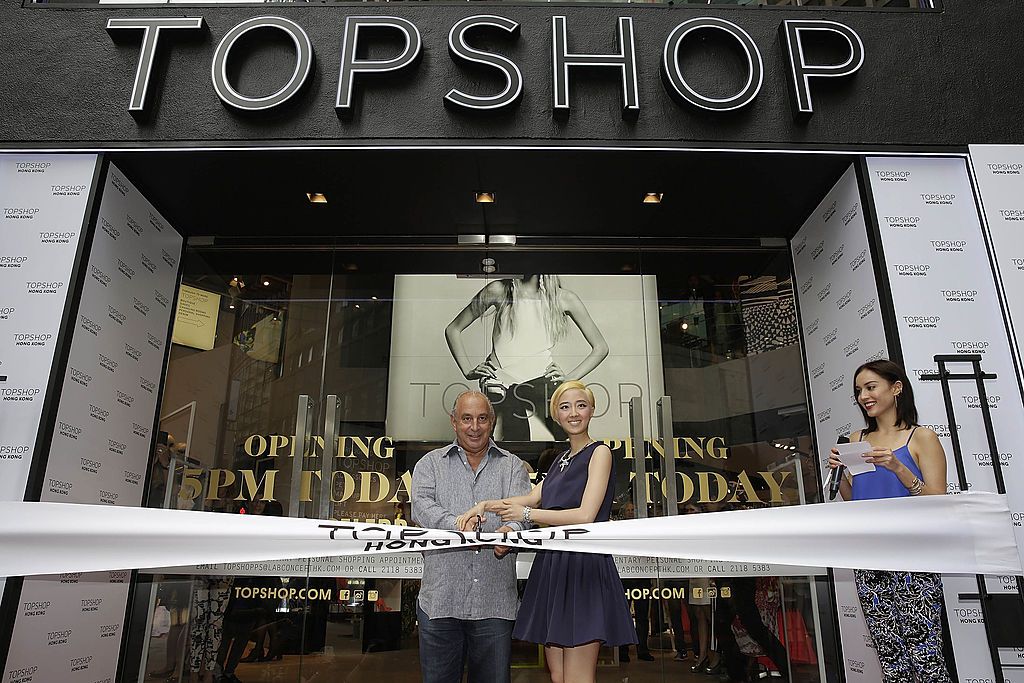 HONG KONG - JUNE 06: Sir Philip Green the owner of Topshop and Taiwanese actress Gwei Lun Mei cut a ribbon to mark the opening of the new Topshop store as TV host Mandy Lieu watches on June 6, 2013 in Hong Kong, Hong Kong. Gwei Lun Mei is the the first Asian ambassador of Topshop. (Photo by Jessica Hromas/Getty Images)