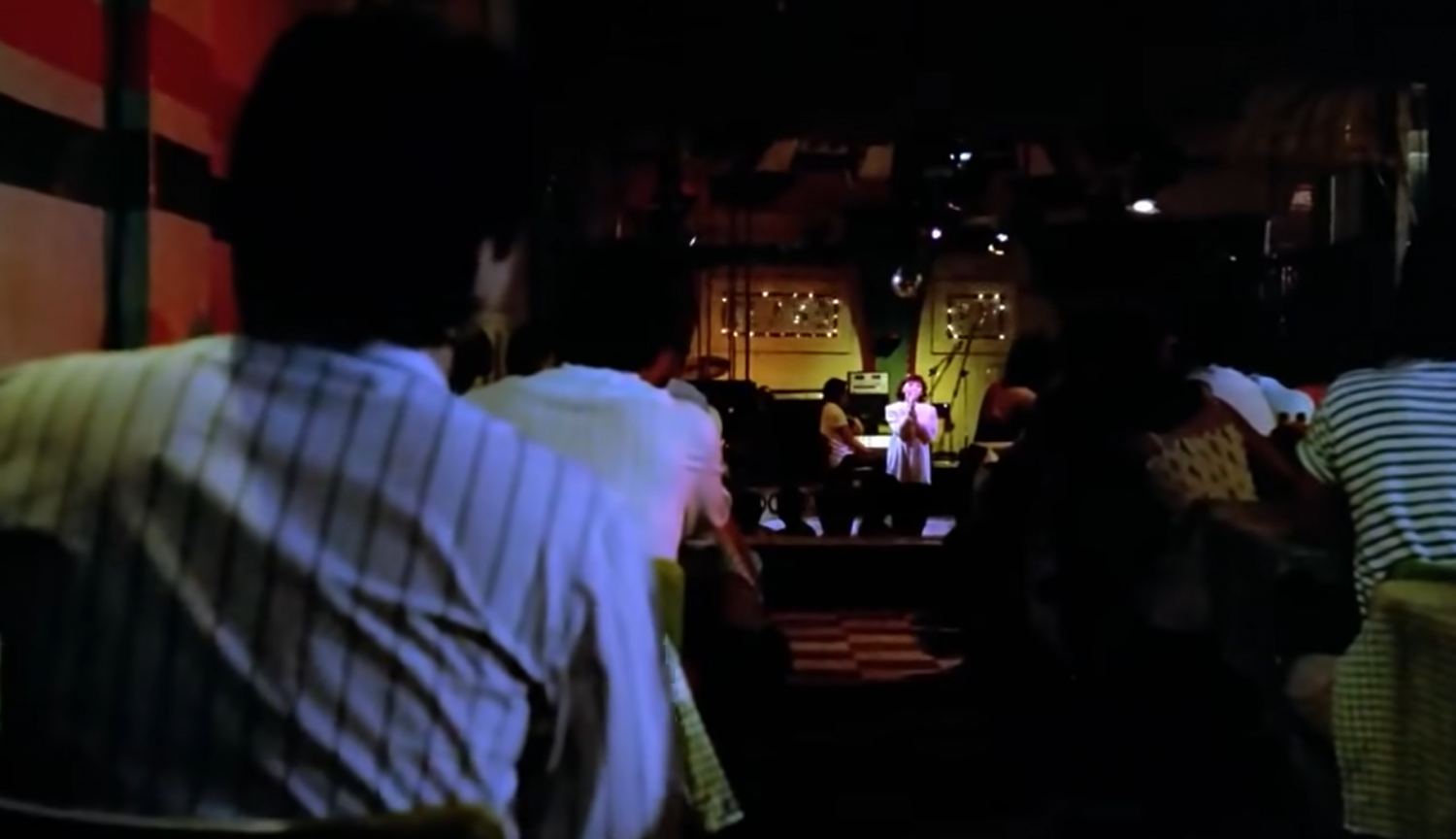 Nico visits a local bar and discovers Dorina’s hidden prowess in singing