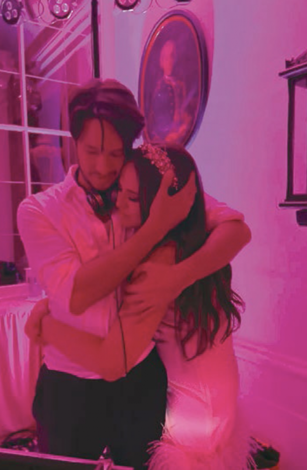 Sam and Georgina in an embrace