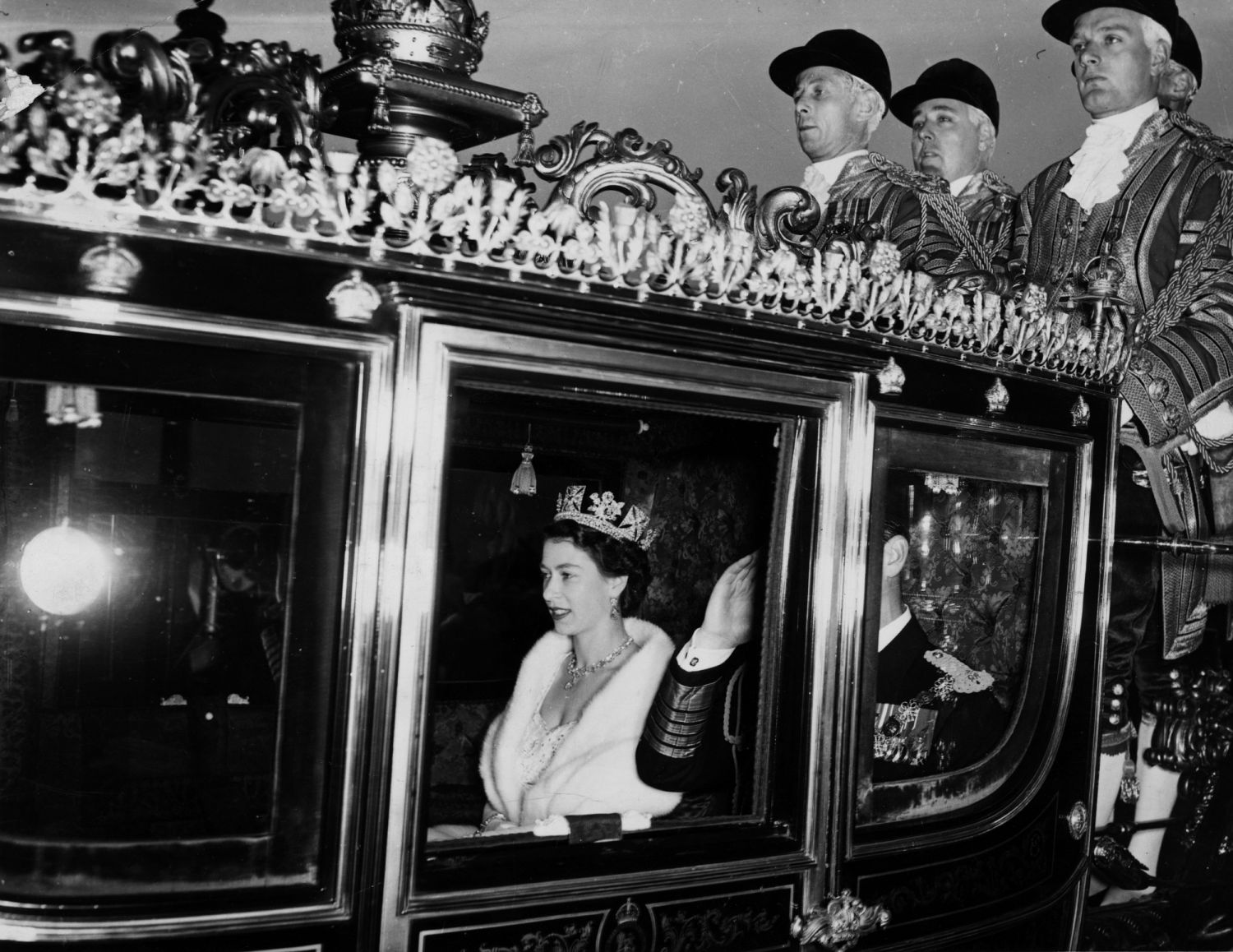Queen Elizabeth II in the traditional Irish state coach travelling to Westminster for her first state opening of parliament as the crowned sovereign. (Photo: Getty Images)