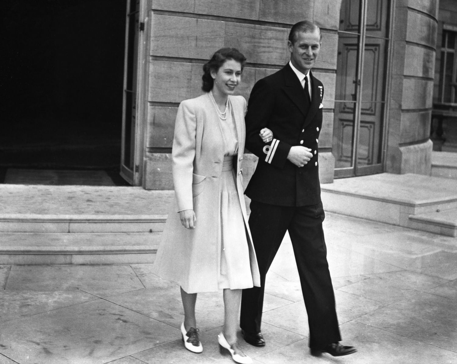 Princess Elizabeth with her fiancee, Lieutenant Philip Mountbatten at Buckingham Palace after the announcement of their engagement by her father the King. (Photo: Getty Images)