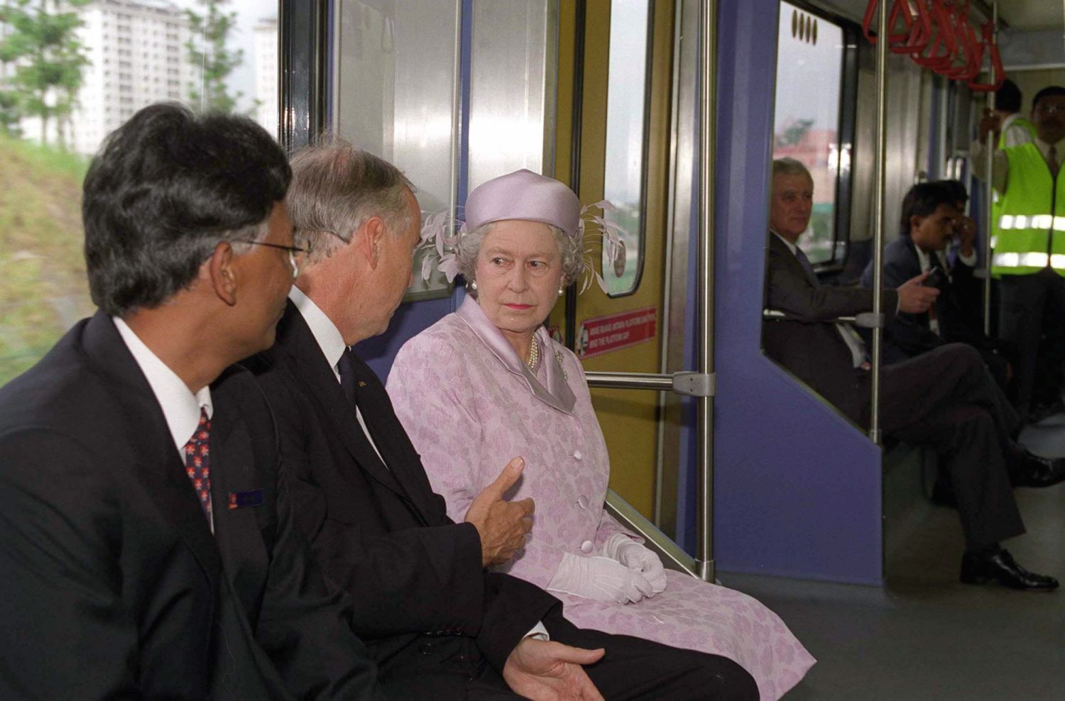 Queen Elizabeth II aboard the LRT train en route to the Commonwealth Games, Malaysia (Photo by Tim Graham Photo Library via Getty Images)