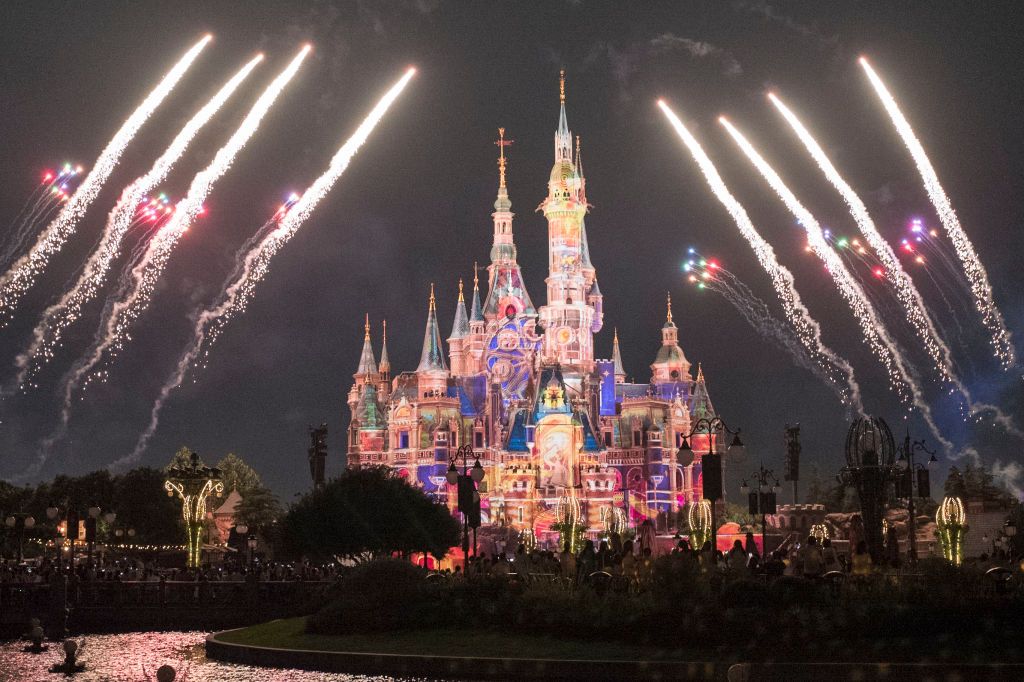 SHANGHAI, CHINA - JUNE 30: Fireworks explode over the Enchanted Storybook Castle at the Shanghai Disney Resort on the reopening day on June 30, 2022 in Shanghai, China. Shanghai Disney Resort reopened on Thursday after more than three months of closure due to the COVID-19 outbreak. (Photo by VCG/VCG via Getty Images)