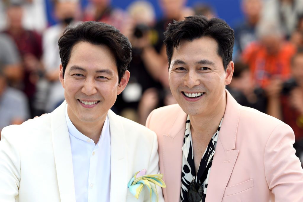 CANNES, FRANCE - MAY 19: (L to R) Lee Jung-Jae and Jung Woo-Sung attend the photocall for "Hunt" during the 75th annual Cannes film festival at Palais des Festivals on May 19, 2022 in Cannes, France. (Photo by Pascal Le Segretain/Getty Images)