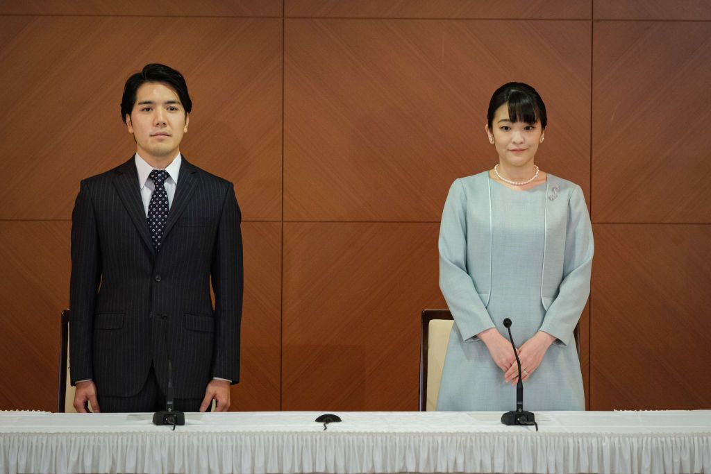 TOKYO, JAPAN - OCTOBER 26: Princess Mako, the elder daughter of Prince Akishino and Princess Kiko, and her husband Kei Komuro, a university friend of Princess Mako, pose during a press conference to announce their wedding at Grand Arc Hotel on October 26, 2021 in Tokyo, Japan. Princess Mako married Kei Komuro today at a registry office following a relationship beset with controversy following the revelation that Mr Komuroâs mother was embroiled in a financial dispute with a former fiancé. Following the w