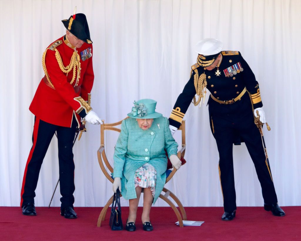 WINDSOR, UNITED KINGDOM - JUNE 13: (EMBARGOED FOR PUBLICATION IN UK NEWSPAPERS UNTIL 24 HOURS AFTER CREATE DATE AND TIME) Queen Elizabeth II, accompanied by Lieutenant Colonel Michael Vernon (Comptroller of the Lord Chamberlain's Office) and Vice Admiral Tony Johnstone-Burt (Master of the Household), attends a military ceremony in the Quadrangle of Windsor Castle to mark her Official Birthday on June 13, 2020 in Windsor, England. It was decided that due to the ongoing COVID-19 Pandemic The Queen's Birthday
