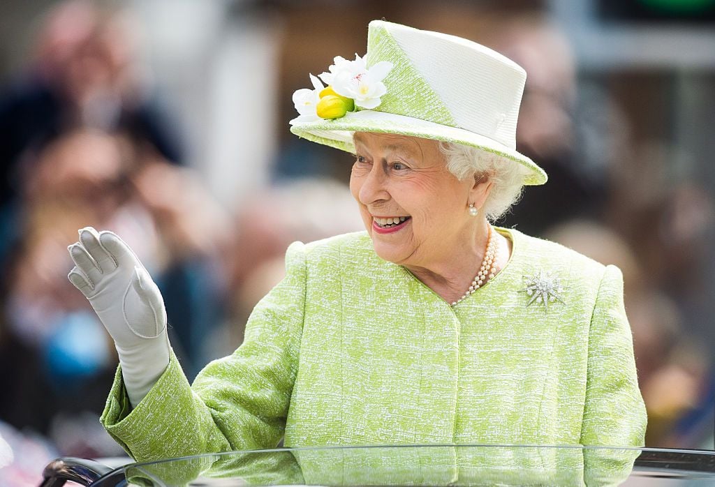WINDSOR, ENGLAND - APRIL 21:  Queen Elizabeth II waves during a walk about around Windsor on her 90th Birthday on April 21, 2016 in Windsor, England.  (Photo by Samir Hussein/WireImage)
