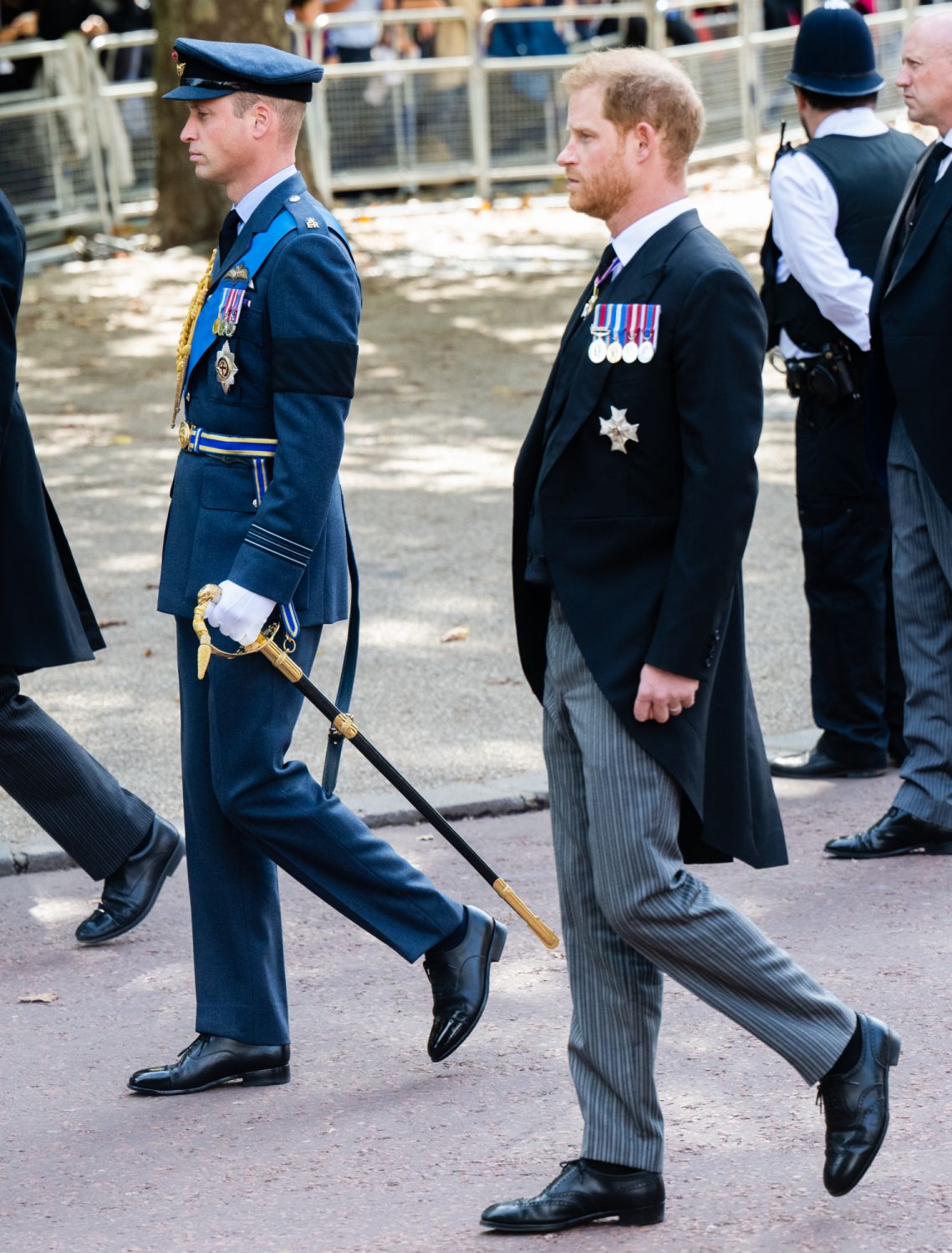 LONDON, ENGLAND - SEPTEMBER 14: Prince William, Prince of Wales and Prince Harry, Duke of Sussex walk behind Queen Elizabeth II's coffin is taken in procession on a Gun Carriage of The King's Troop Royal Horse Artillery from Buckingham Palace to Westminster Hall on September 14, 2022 in London, England. Queen Elizabeth II will lay in state until the early morning of her funeral. Queen Elizabeth II died at Balmoral Castle in Scotland on September 8, 2022, and is succeeded by her eldest son, King Charles III