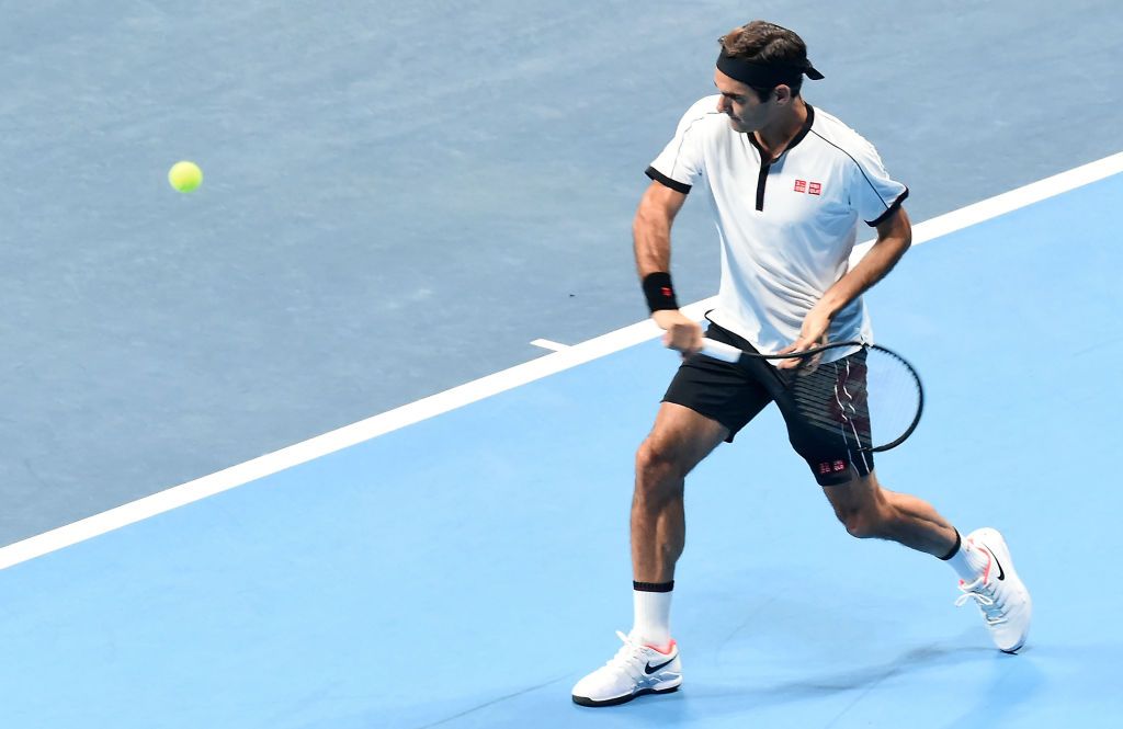 TOKYO, JAPAN - OCTOBER 14: Roger Federer of Switzerland returns a shot against John Isner of the United States during Uniqlo LifeWear Day Tokyo charity match at the Ariake Coliseum on October 14, 2019 in Tokyo, Japan. (Photo by Jun Sato/WireImage)