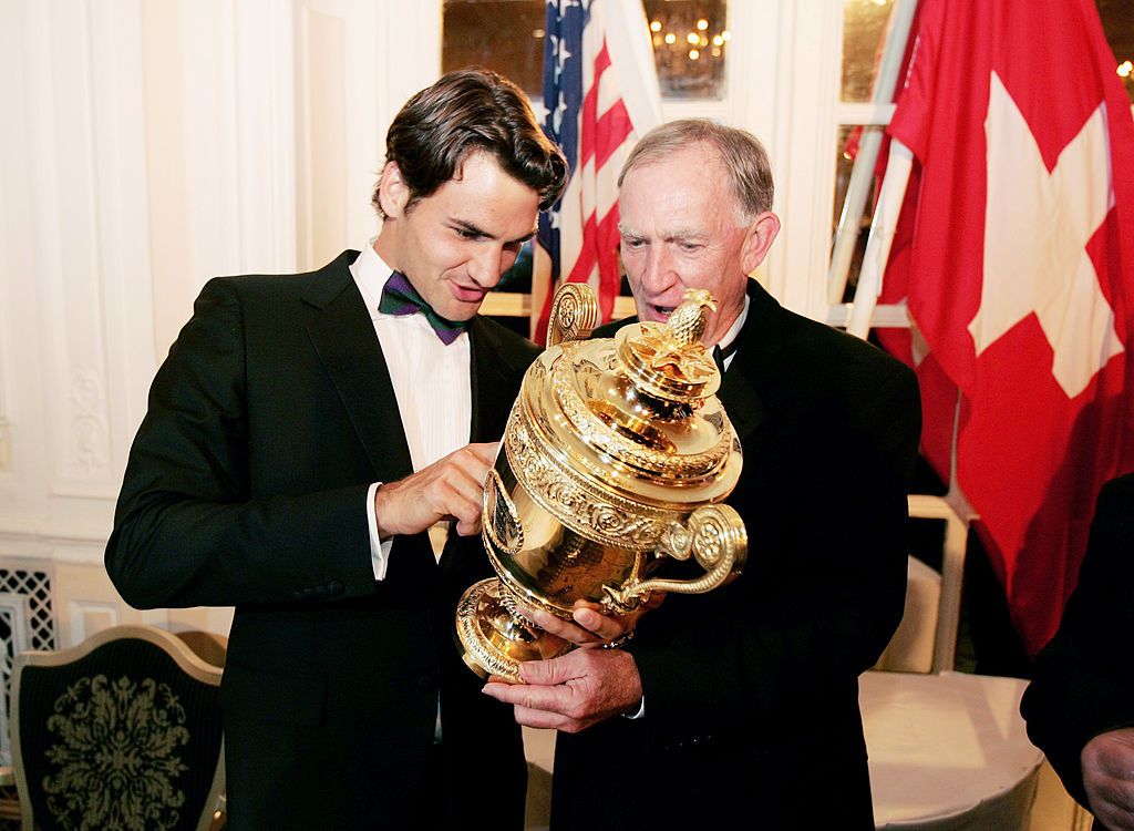 LONDON - JULY 03: Wimbledon champion Roger Federer and his coach Tony Roche look at the trophy at the Wimbledon Winners Dinner at the Savoy Hotel on July 3, 2005 in London. (Photo by Clive Brunskill/Getty Images)