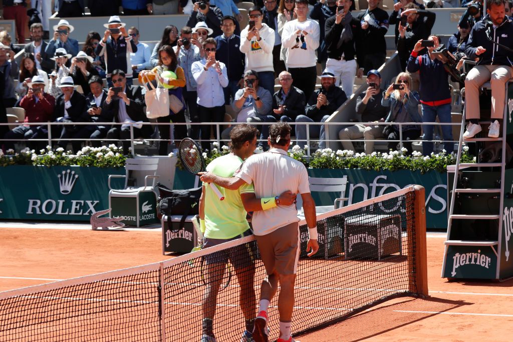 PARIS, FRANCE - JUNE 07: Tennis players Rafael Nadal and Roger Federer congratulate eachother at the end of their semi final of the 2019 French Tennis Open - Day Thirteen at Roland Garros on June 07, 2019 in Paris, France. (Photo by Rindoff Petroff/Suu/Getty Images)