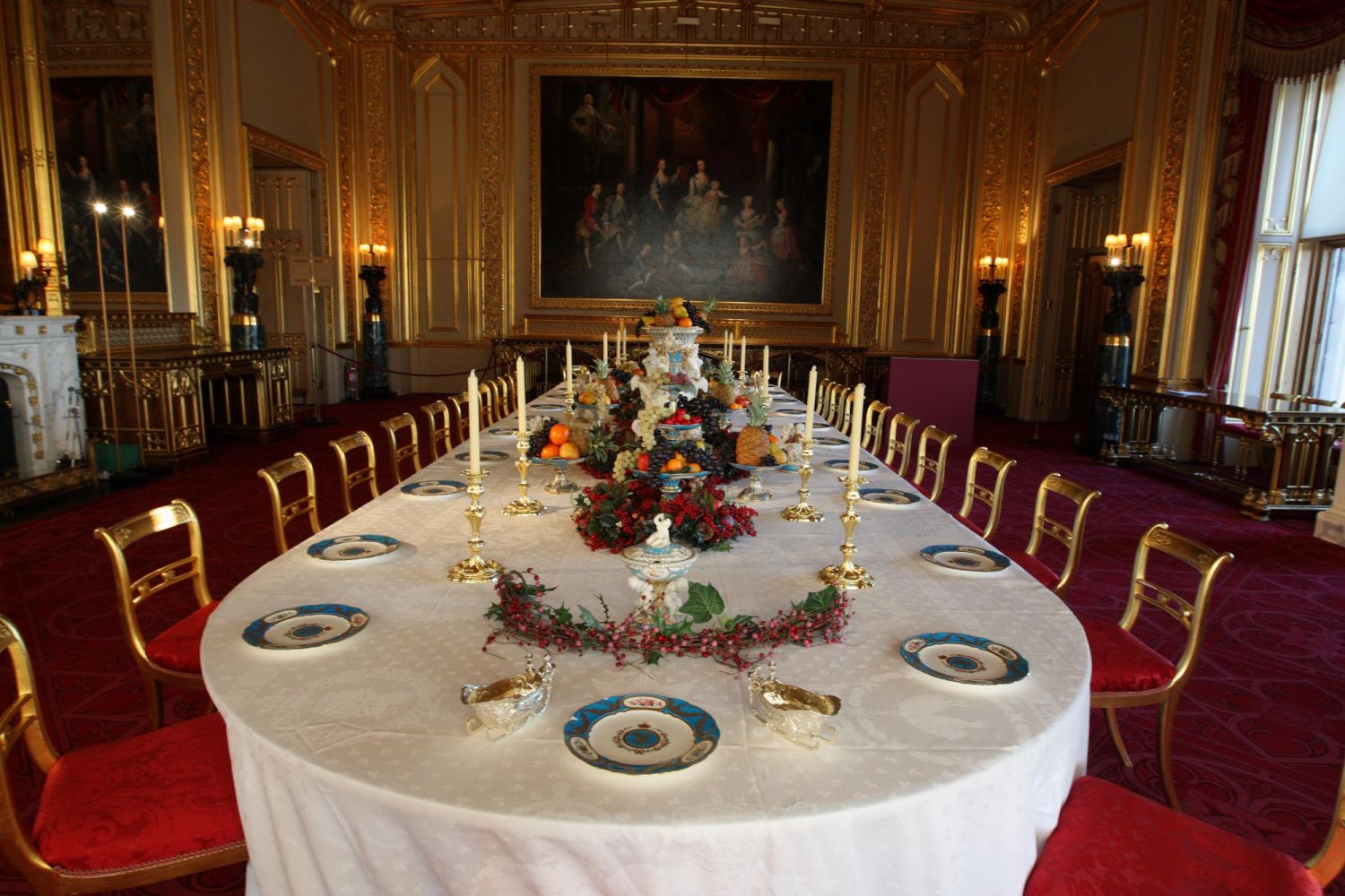 The finishing touches are made to the table in Windsor Castle's state dining room, which has be laid for a Victorian Christmas feast with a lavish porcelain dessert service by Minton of Staffordshire, which Queen Victoria bought at the Great Exhibition of 1851. (Photo by Steve Parsons/PA Images via Getty Images)