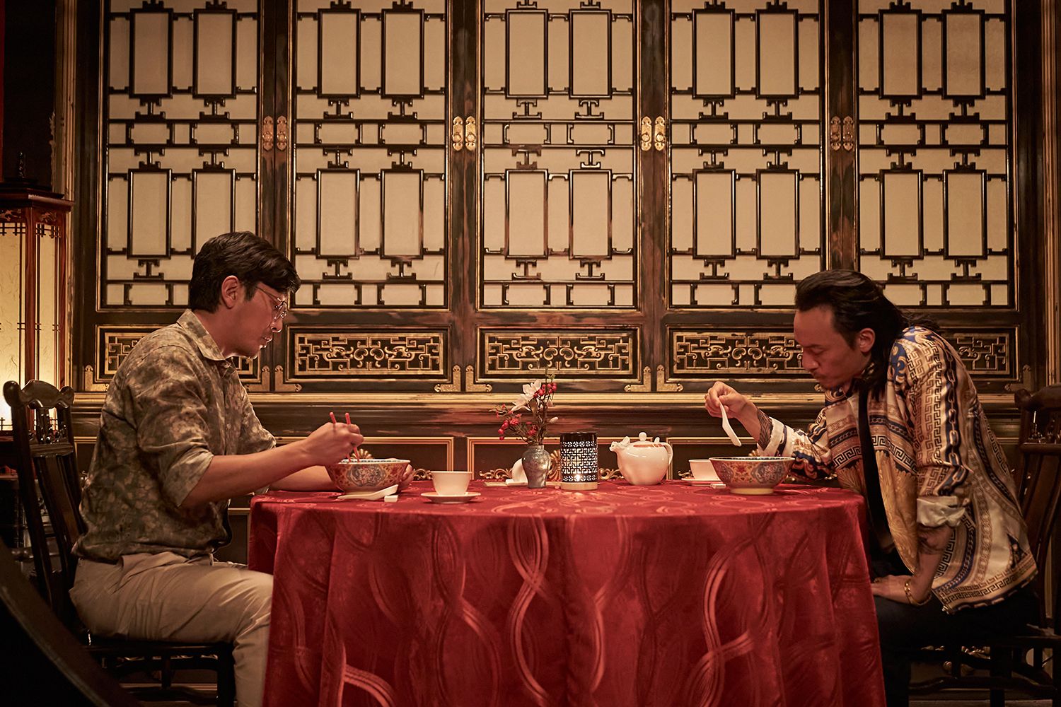 Narco-Saints (L to R) Ha Jung-woo as Kang Ingu, Chang Chen as Chen Zhen in Narco-Saints Cr. Cho Wonjin/Netflix Â© 2022