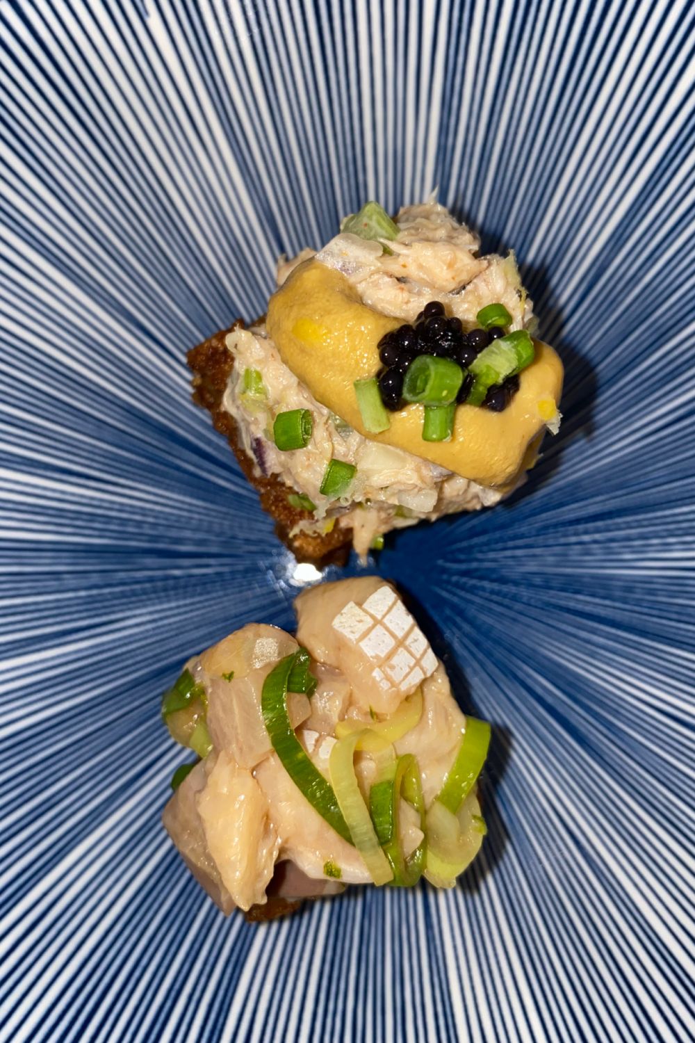 Crispy rice topped with hamachi and crab salad | Keepers Poblacion