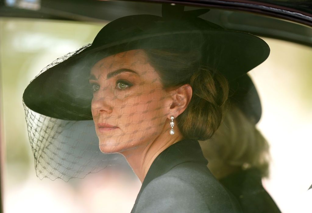 LONDON, ENGLAND - SEPTEMBER 19: The Princess of Wales and the Queen Consort (behind) follows the State Gun Carriage carrying the coffin of Queen Elizabeth II, draped in the Royal Standard with the Imperial State Crown and the Sovereign's orb and sceptre, in the Ceremonial Procession following her State Funeral at Westminster Abbey, on September 19, 2022 in London, England. (Photo Mike Egerton - WPA Pool/Getty Images)