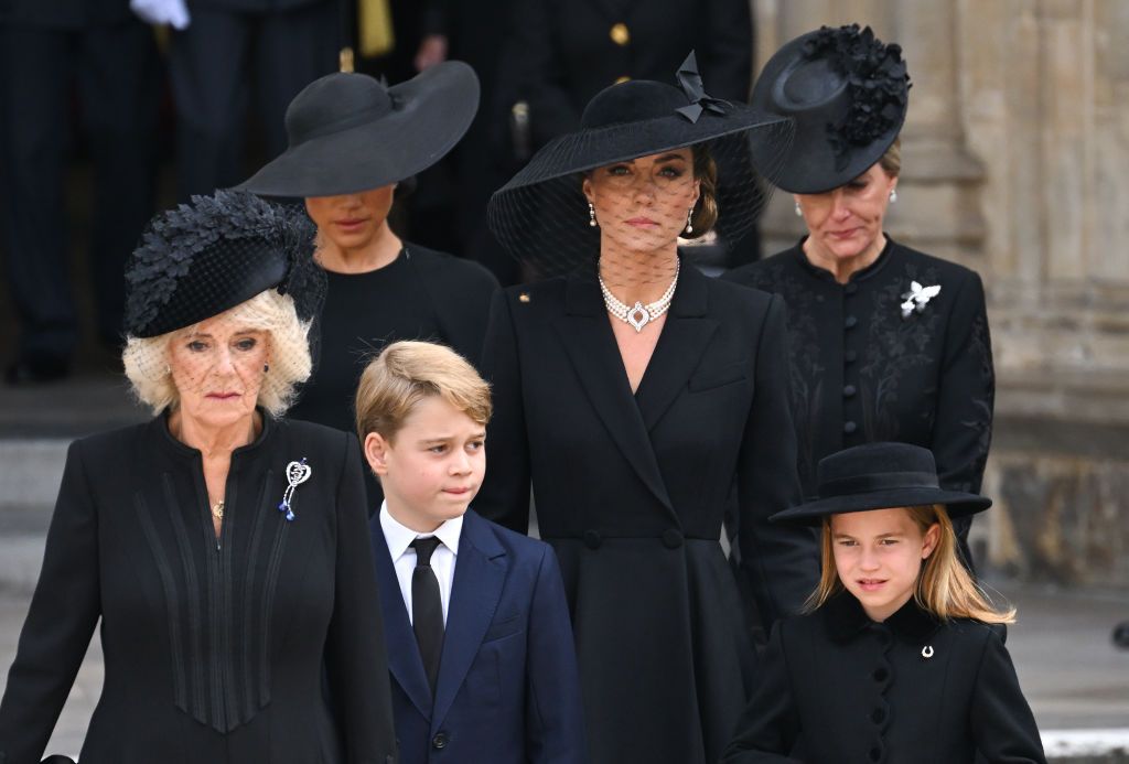 LONDON, ENGLAND - SEPTEMBER 19: (L-R) Camilla, Queen Consort, Meghan, Duchess of Sussex, Prince George of Wales, Catherine, Princess of Wales, Princess Charlotte of Wales and Sophie, Countess of Wessex during the State Funeral of Queen Elizabeth II at Westminster Abbey on September 19, 2022 in London, England. Elizabeth Alexandra Mary Windsor was born in Bruton Street, Mayfair, London on 21 April 1926. She married Prince Philip in 1947 and ascended the throne of the United Kingdom and Commonwealth on 6 Febr