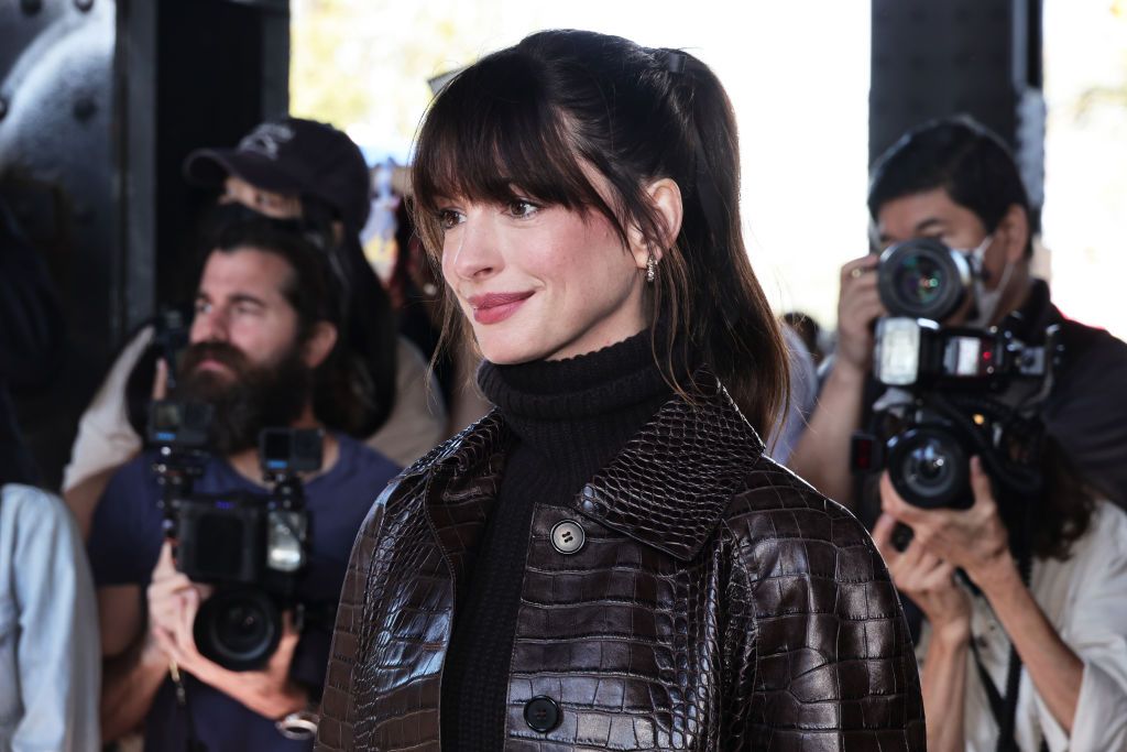 NEW YORK, NEW YORK - SEPTEMBER 14: Anne Hathaway attends the Michael Kors Collection Spring/Summer 2023 Runway Show on September 14, 2022 in New York City. (Photo by Jamie McCarthy/Getty Images for Michael Kors)