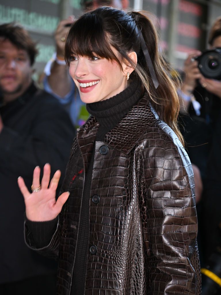 NEW YORK, NEW YORK - SEPTEMBER 14: Anne Hathaway arrives to Michael Kors fashion show at Highline Stages on September 14, 2022 in New York City. (Photo by James Devaney/GC Images)
