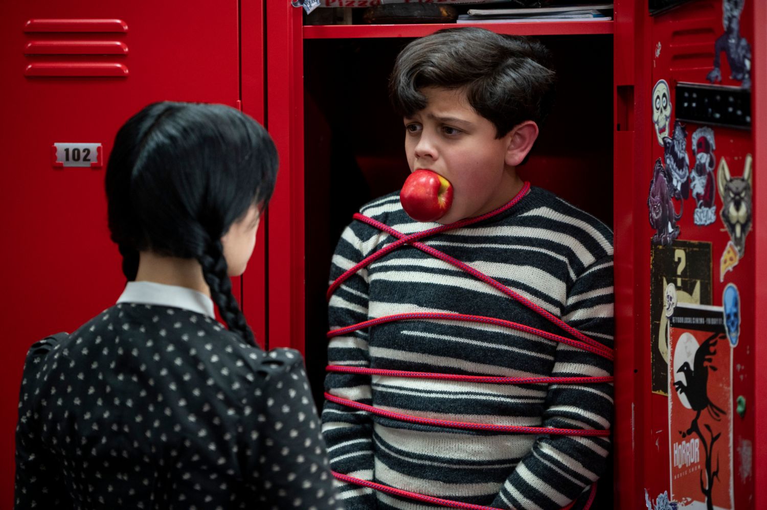 Wednesday. (L to R) Jenna Ortega as Wednesday Addams, Issac Ordonez as Pugsley Addams in episode 101 of Wednesday. Photo via Vlad Cioplea/Netflix