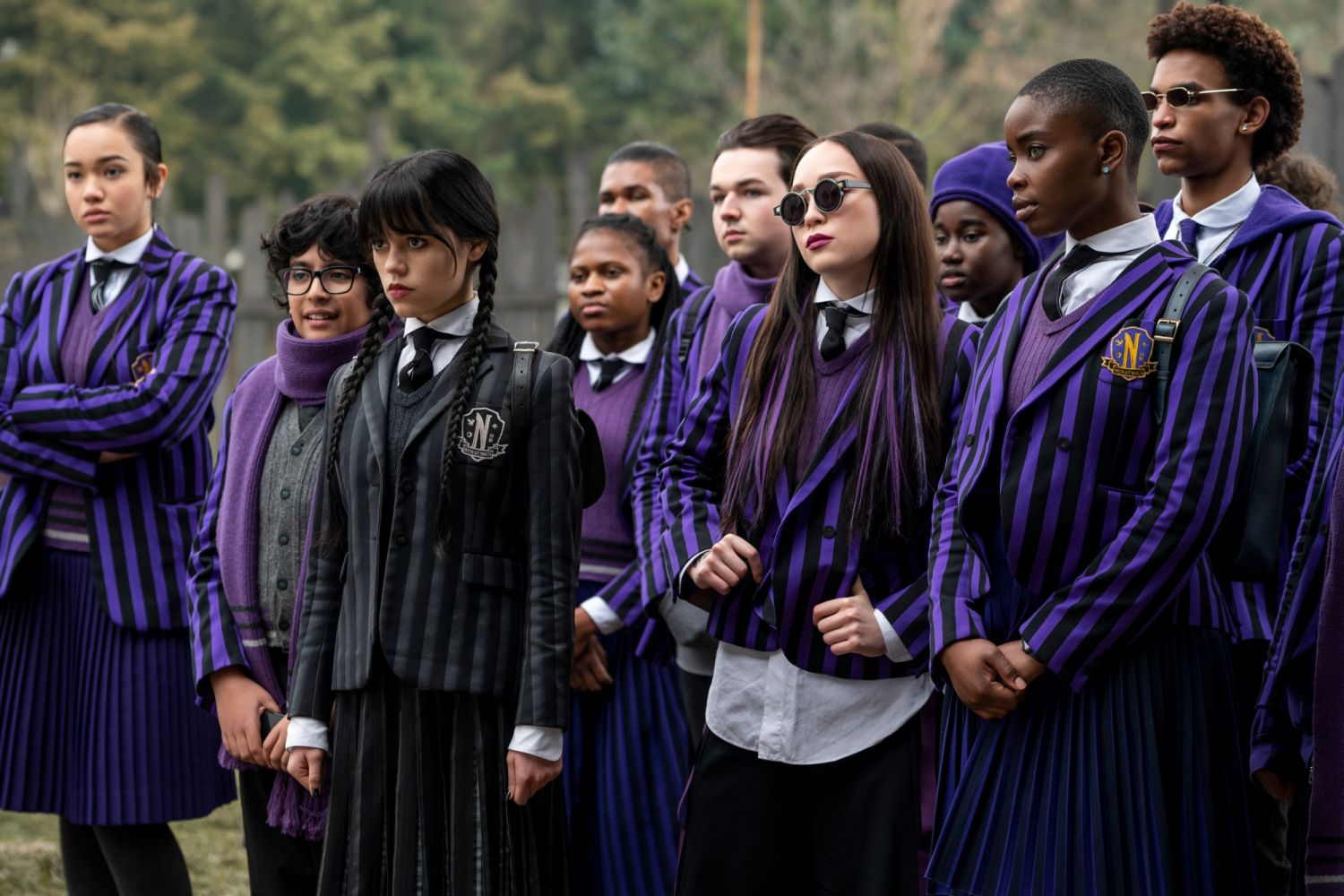 Wednesday. (L to R) Moosa Mostafa as Eugene Otinger, Jenna Ortega as Wednesday Addams, Naomi j Ogawa as Yoko Tanaka, Joy Sunday as Bianca Barclay in episode 103 of Wednesday. Photo via Netflix