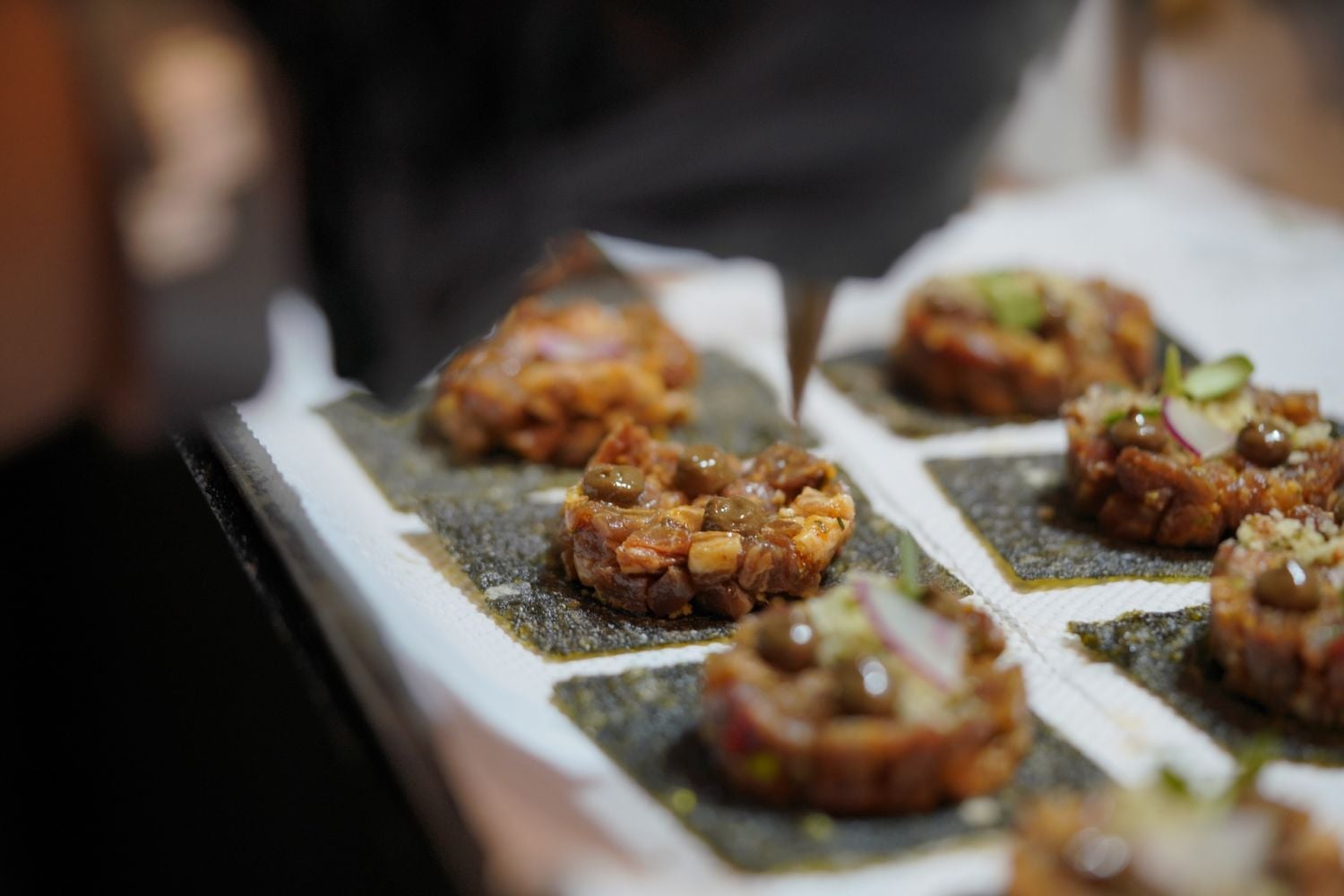 Off Menu Philippines 2022 - Chef Carlos Garcia’s smoked ibérico presa on crispy nori, which accompanied chef Tom Bascon’s kansi chawanmushi
