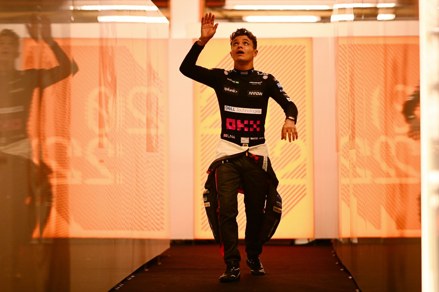 SINGAPORE, SINGAPORE - SEPTEMBER 29: Lando Norris of Great Britain and McLaren walks in the Paddock during previews ahead of the F1 Grand Prix of Singapore at Marina Bay Street Circuit on September 29, 2022 in Singapore, Singapore. (Photo by Clive Mason/Getty Images,)