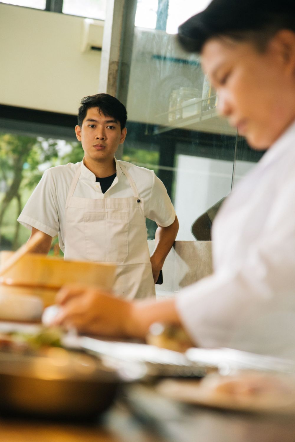 Chef Daniel watching on as Chef Haruka expertly rolls up her Italian saba roll