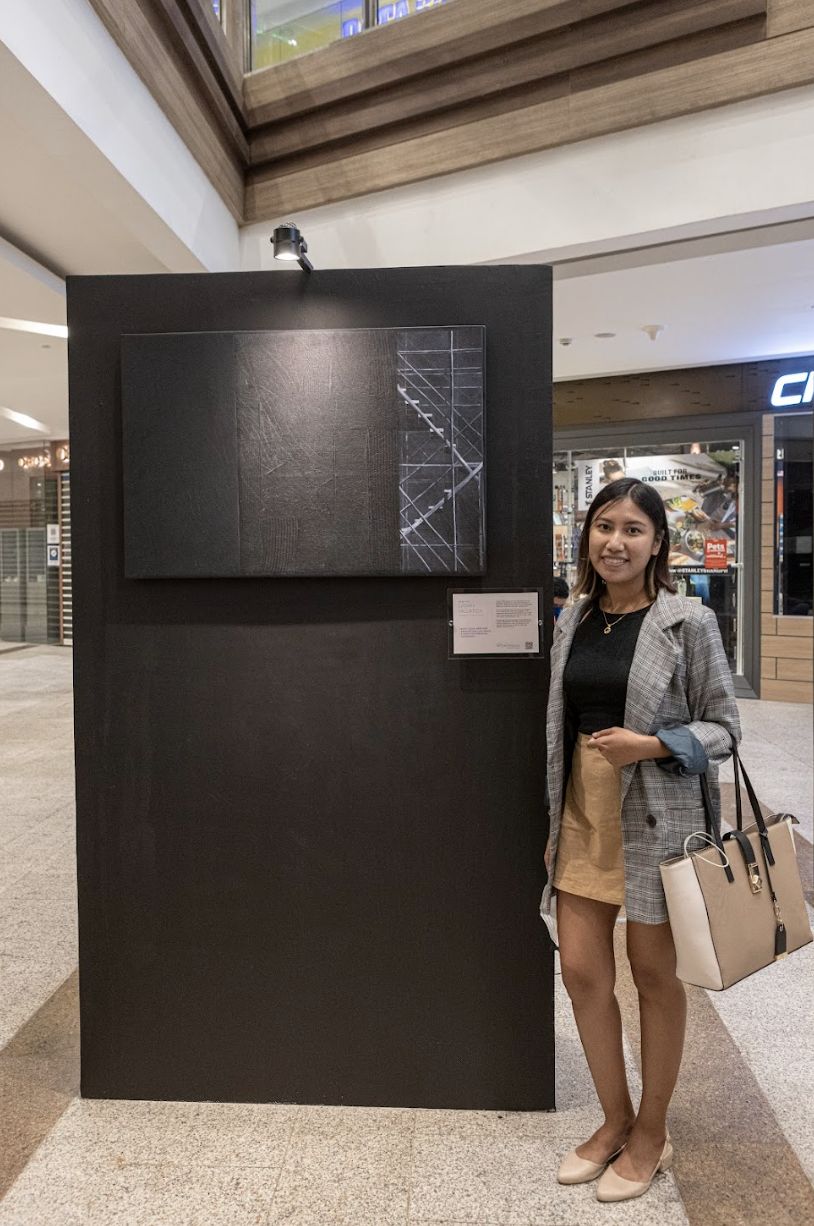 Sarah Pallarca with her artwork