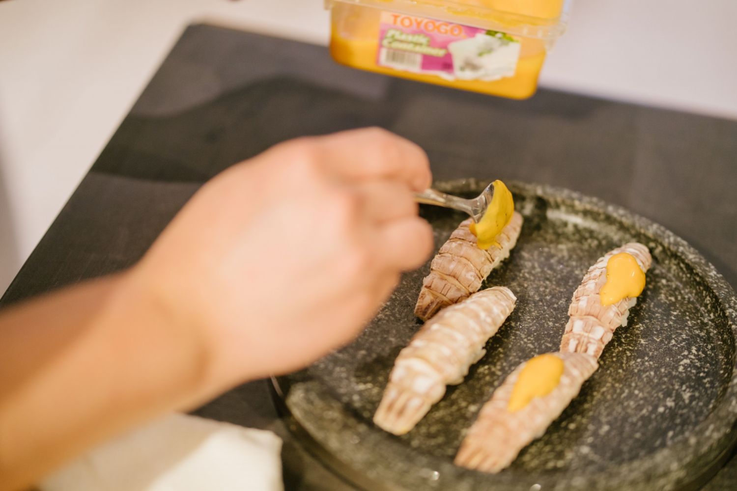 Ronii Lee's mantis shrimp nigiri was topped off with a silky smooth uni and egg yolk emulsion