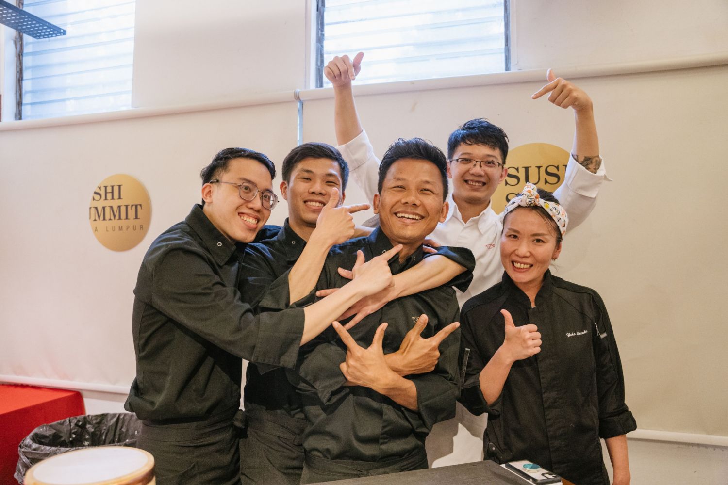 The chefs of Sushi Hibiki enjoying a moment of laughter with Yuko Suzuki
