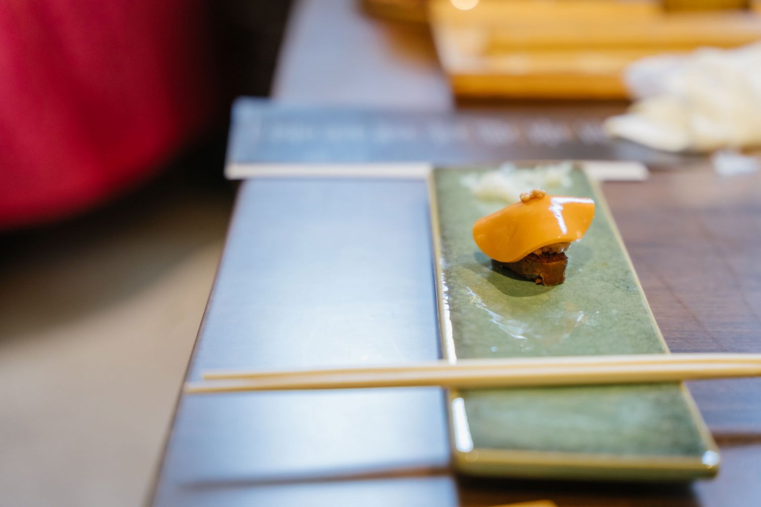 One of Michael Yee's creations, smoked sweetfish roe with a uni gel disc and mustard seeds