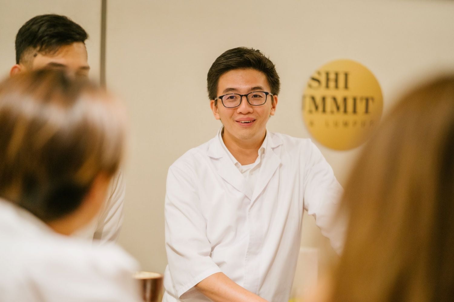 Khong Chan Chuan mid-conversation with diners