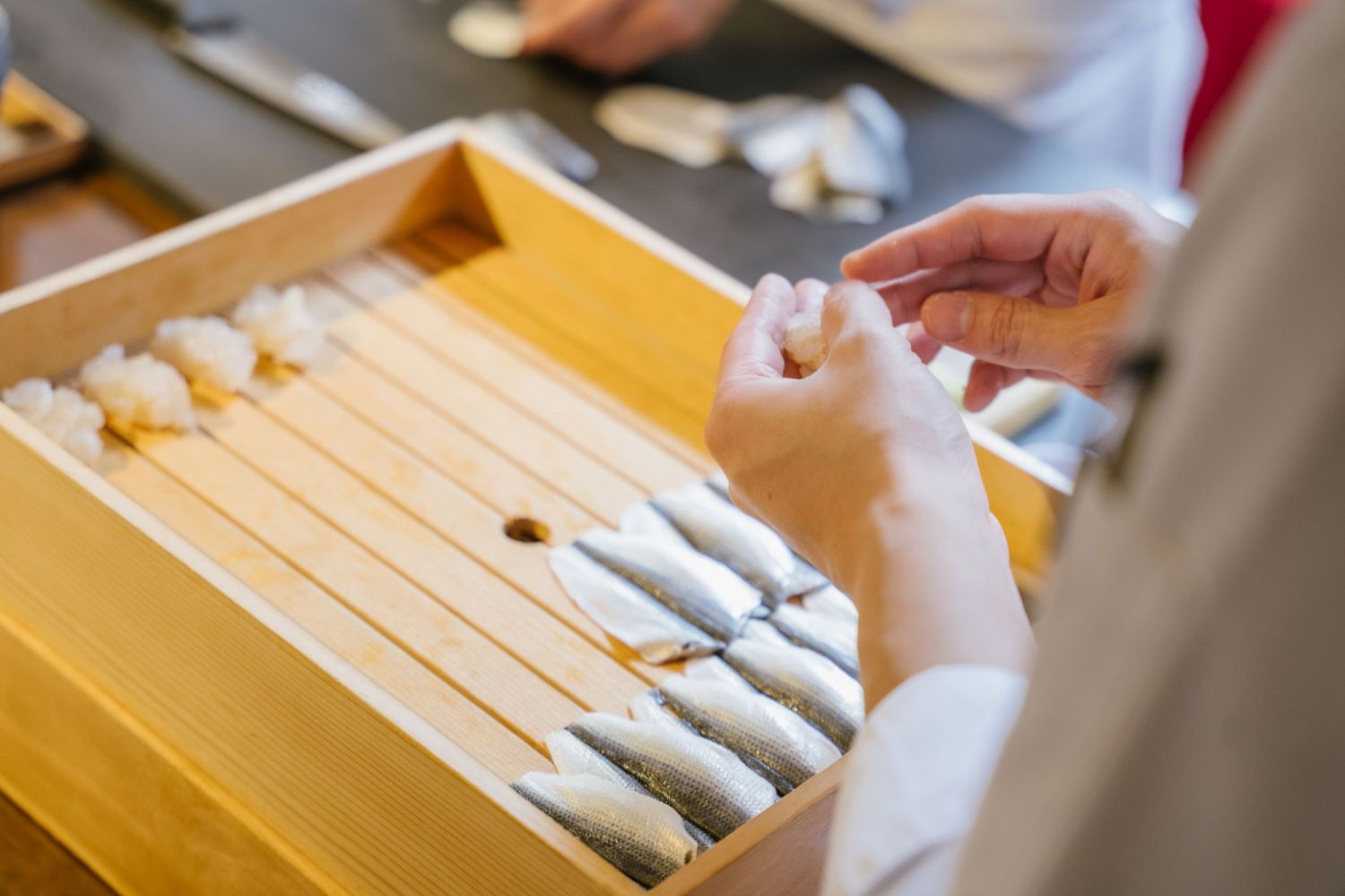 Makoto Saito Sam preparing the kohada (gizzard shad)