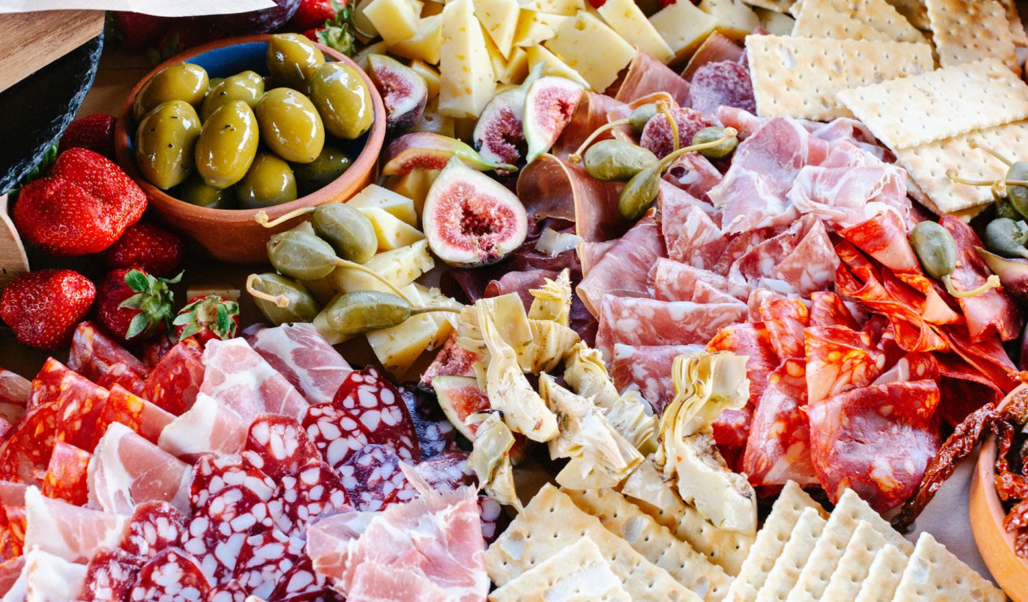 Still life view of different types of food and snacks during wedding reception.