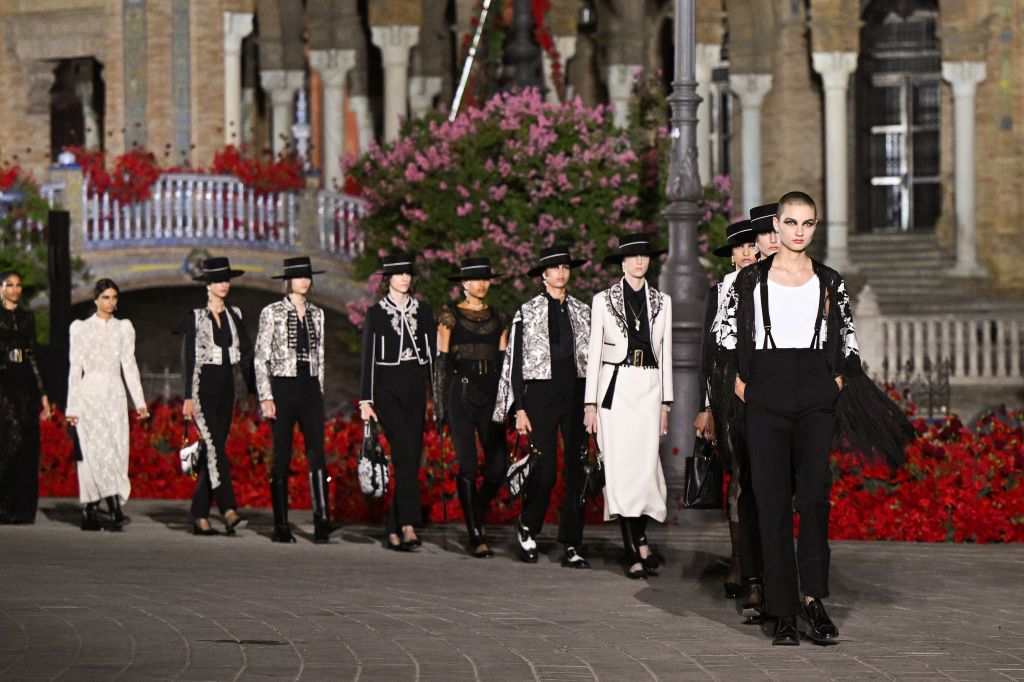 SEVILLE, SPAIN - JUNE 16: Models walk the runway during the Dior "Crucero Collection" fashion show by Christian Dior at Plaza de España on June 16, 2022 in Seville, Spain. (Photo by Stephane Cardinale - Corbis/Corbis via Getty Images)