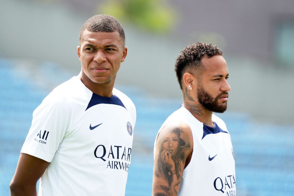TOKYO, JAPAN - JULY 18: (L-R) Neymar Jr and Kylian Mbappe of Paris Saint-Germain look on the Paris Saint-Germain Japan Tour Kids Clinic at Prince Chichibu Memorial Rugby Ground on July 18, 2022 in Tokyo, Japan. (Photo by Koji Watanabe/Getty Images)