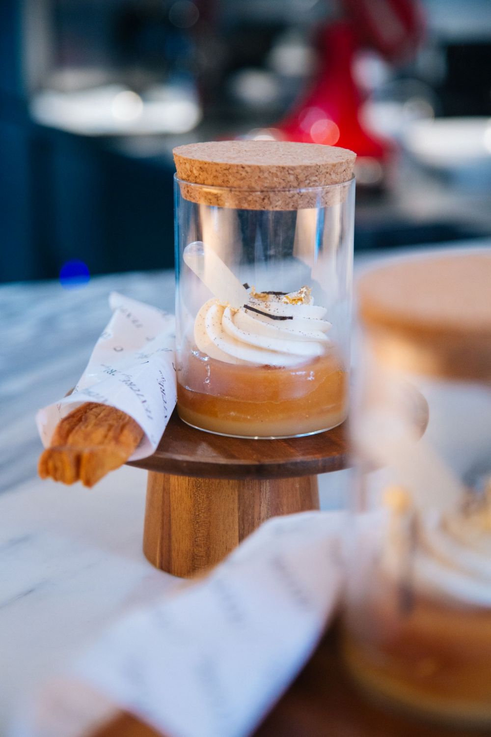 Chong's apple tatin will be served in a simple glass jar with a palmier stick on the side