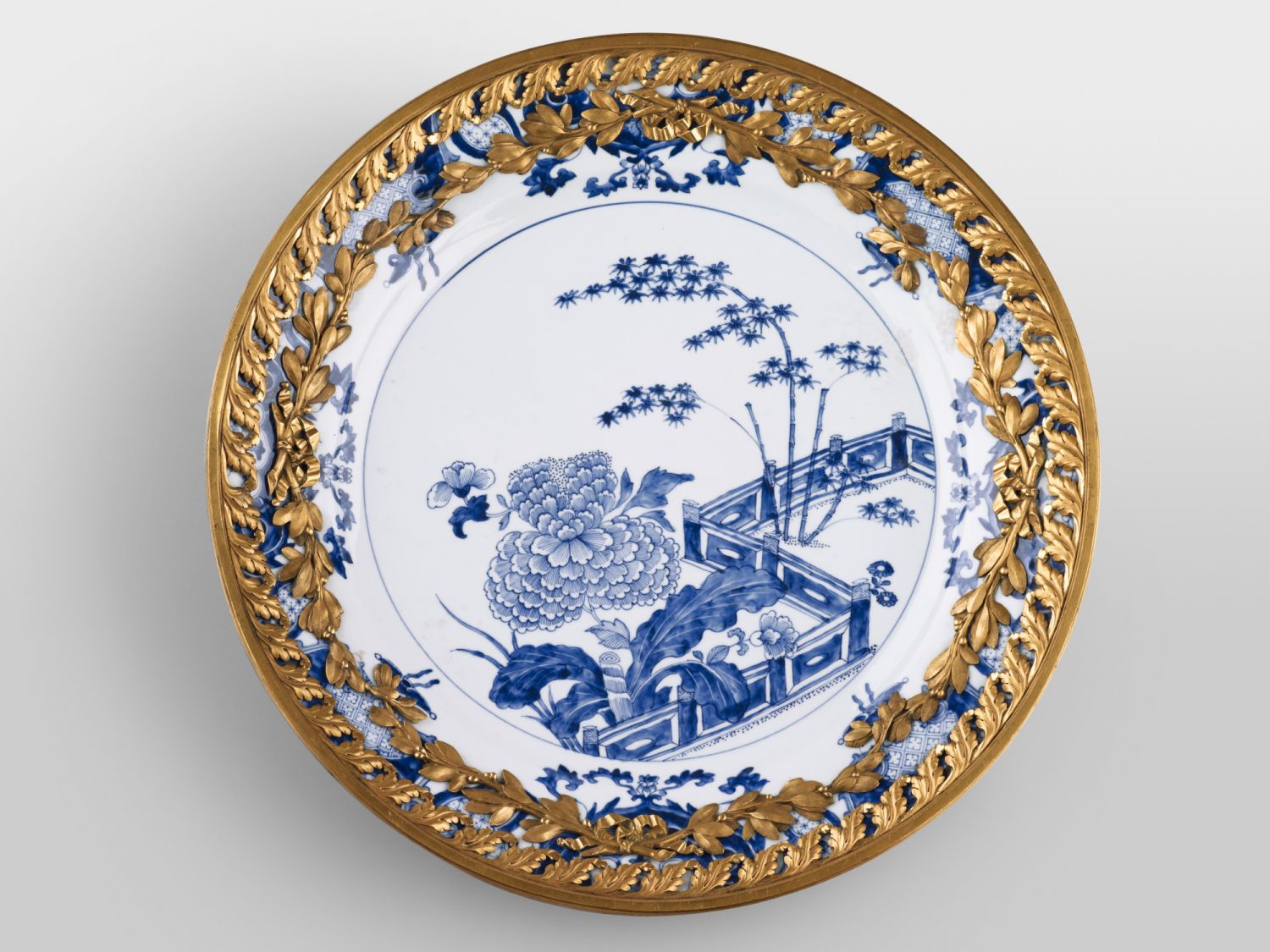 Dish with garden motif, Porcelain with underglaze blue (Jingdezhen, China, 1736–1795), gilded bronze mounts (Austria, about 1775–1785) attributed to Ignaz Joseph Würth (Austrian, 1742–1792)
