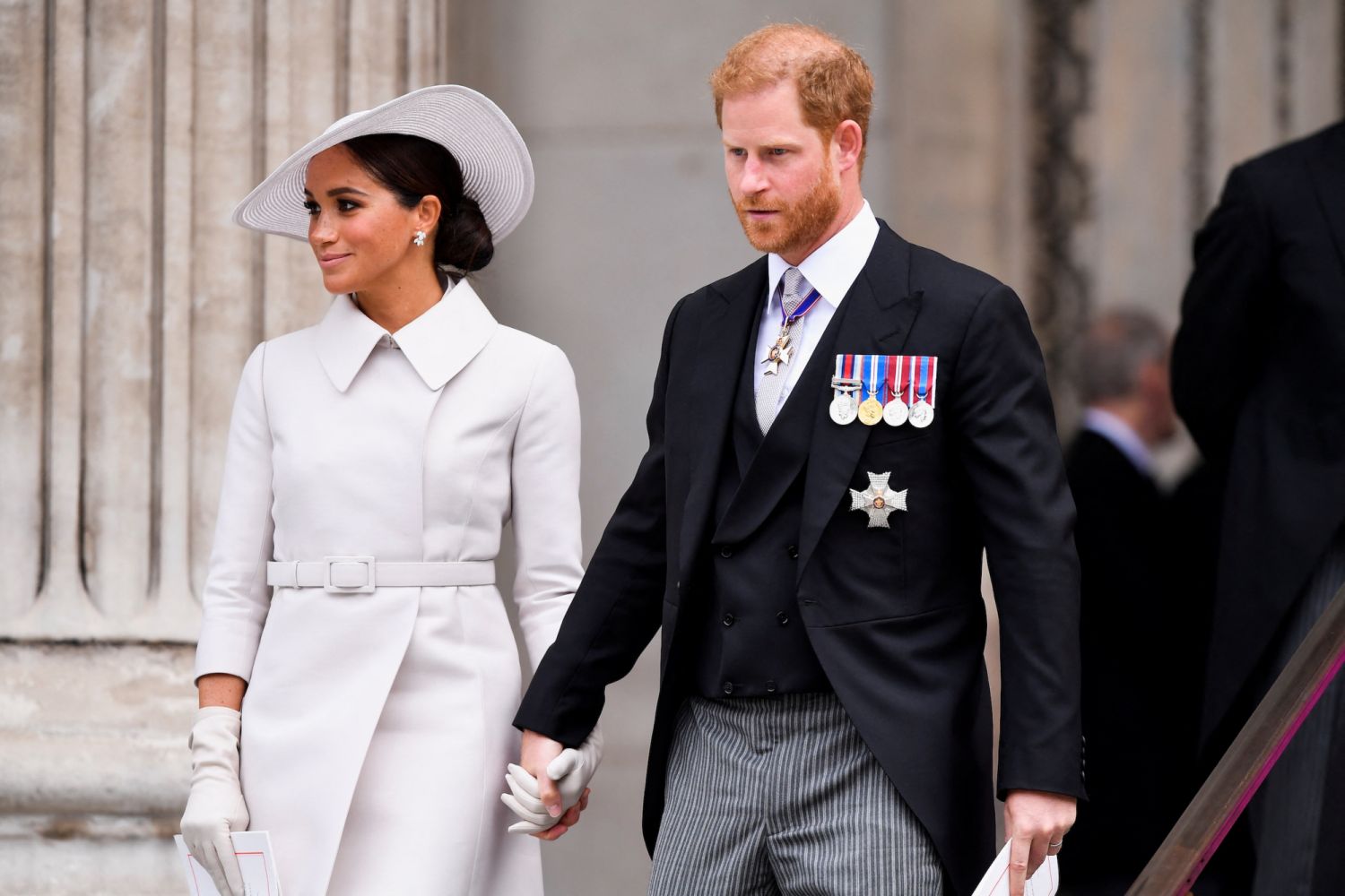LONDON, ENGLAND - JUNE 03: Prince Harry, Duke of Sussex, and Meghan, Duchess of Sussex after attending the National Service of Thanksgiving at St Paul's Cathedral during the Queen's Platinum Jubilee celebrations on June 3, 2022 in London, England. The Platinum Jubilee of Elizabeth II is being celebrated from June 2 to June 5, 2022, in the UK and Commonwealth to mark the 70th anniversary of the accession of Queen Elizabeth II on 6 February 1952. (Photo by Toby Melville - WPA Pool/Getty Images)