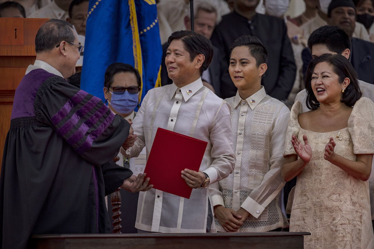 MANILA, PHILIPPINES - JUNE 30: Ferdinand "Bongbong" Marcos Jr. shakes the hand of Supreme Court Chief Justice Alexander Gesmundo after taking his oath as the next Philippine President, at the National Museum of Fine Arts on June 30, 2022 in Manila, Philippines. Ferdinand "Bongbong" Marcos Jr. took his oath as the next Philippine President on Thursday, completing a once unthinkable political revival of his family 36 years after his dictator father, Ferdinand Marcos Sr., was ousted by millions of Filipinos in